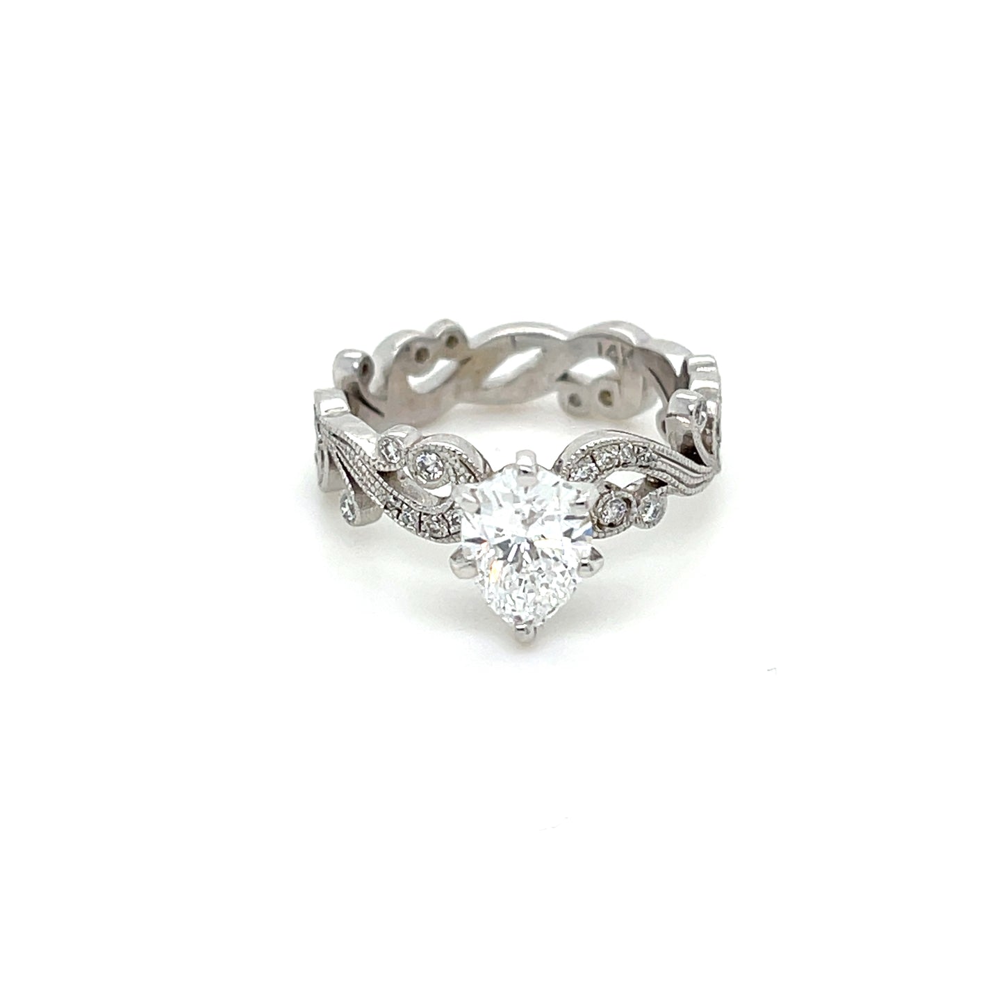 1.01 CT Pear Shape Diamond Center (Certified GIA) with 0.78 CT Round Brilliant Cut Diamonds in a 14 KT White Gold Engagement Ring